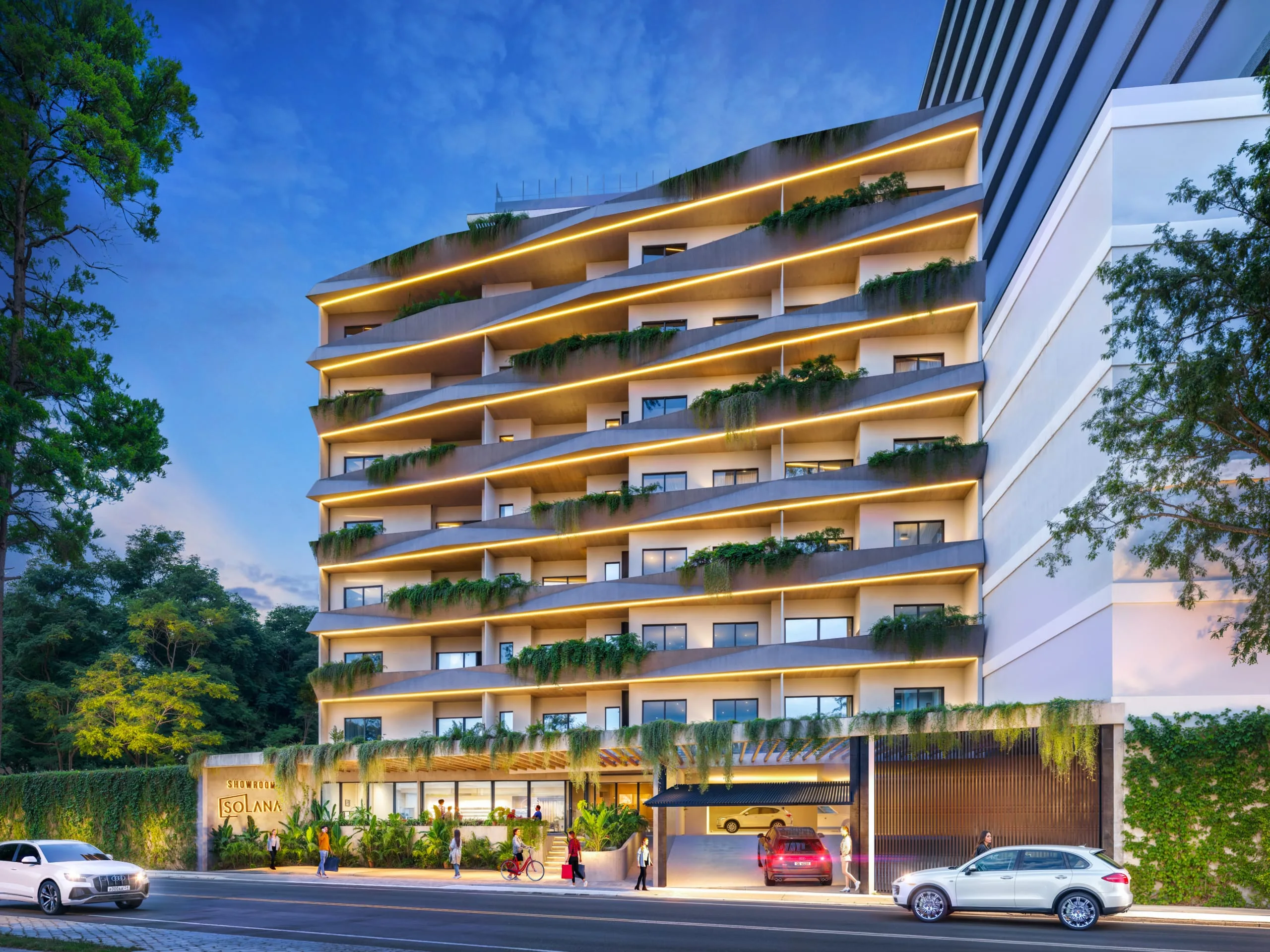 The illuminated facade with its green balconies at the Solana 2 apartment complex at dusk in Asunción, Paraguay.