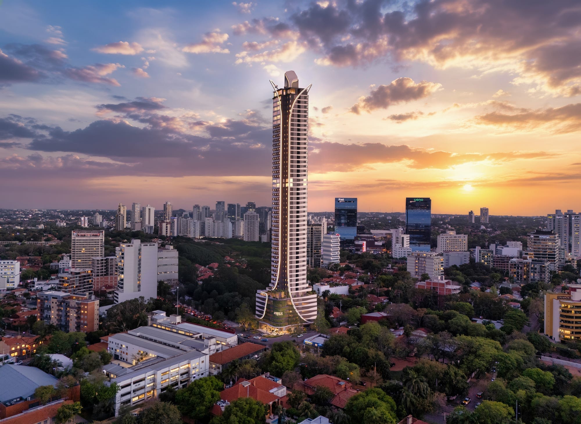Vue aérienne de la tour Aether by Civis et du quartier de Las Lomas au coucher du soleil, à Asunción, Paraguay.