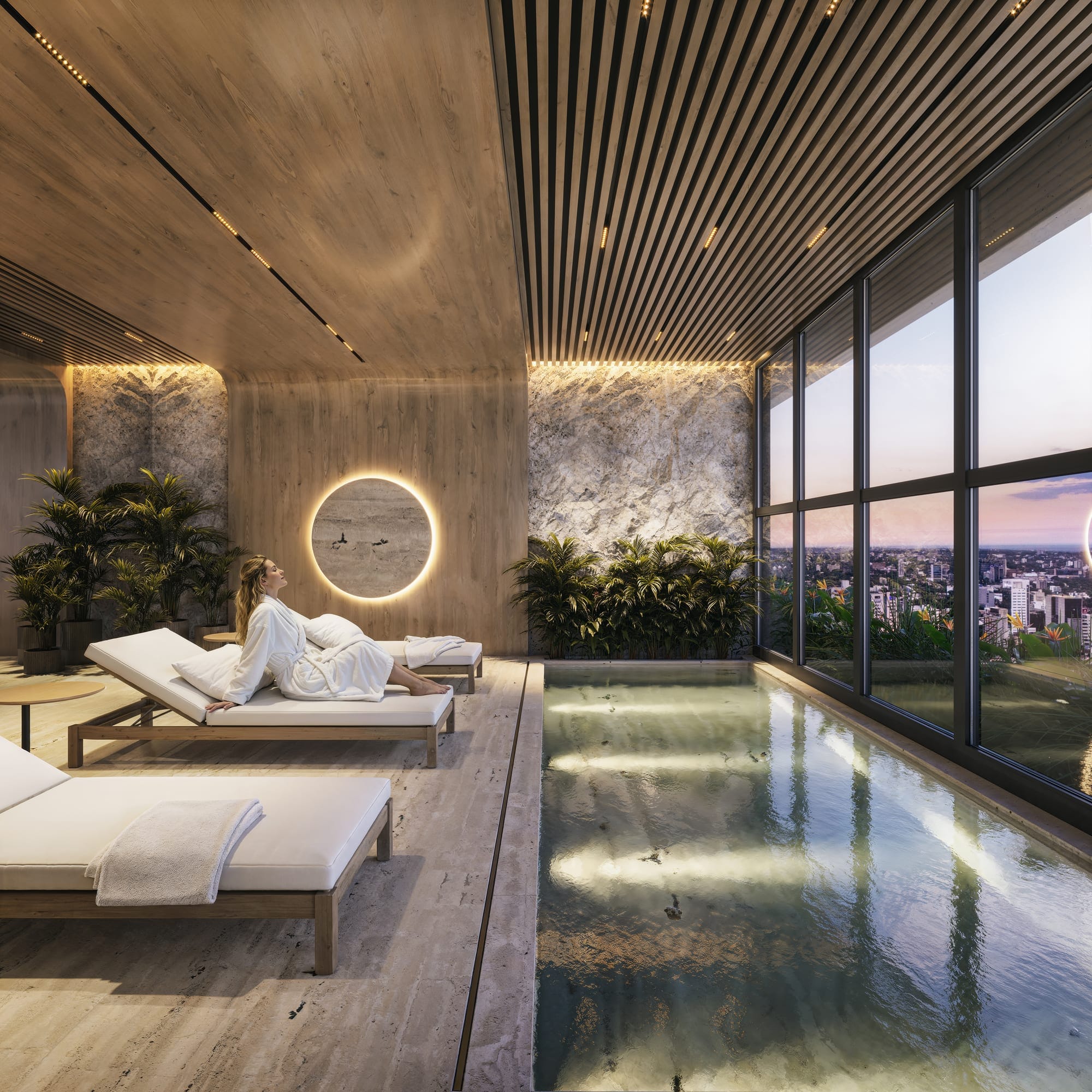 Spa avec bassin intérieur, transats et vue sur la ville dans la résidence Aether by Civis à Asunción, Paraguay.