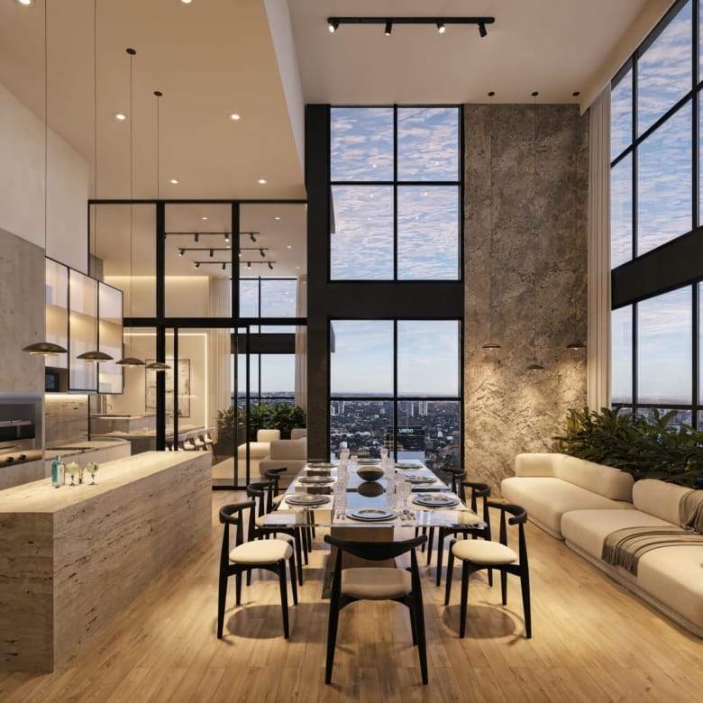 Quincho en double hauteur avec cuisine, grande table et salon dans la résidence Aether by Civis à Asunción, Paraguay.