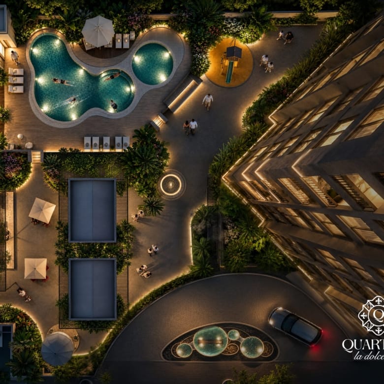 Vue aérienne des piscines aux formes organiques et des jardins au pied de la tour Quartiere à Asunción, Paraguay.