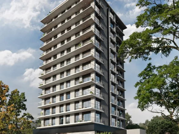 Façade d’angle de la résidence Urban Mburucuyá vue depuis le trottoir, à Asunción, Paraguay.
