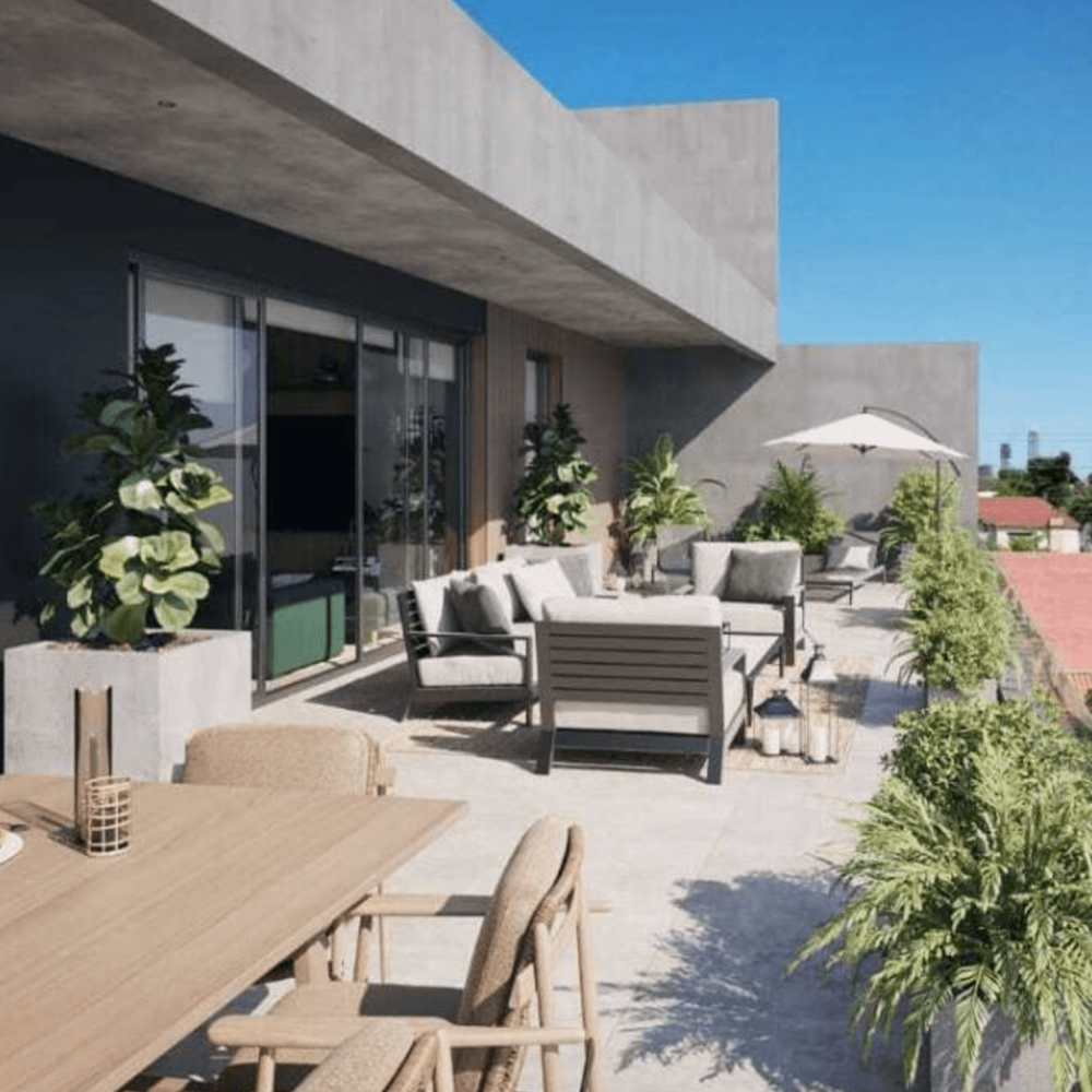 Terrasse contemporaine d’un appartement à Asunción, au Paraguay, avec mobilier extérieur, plantes, espace repas et vue sur un quartier résidentiel verdoyant.